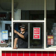 Drive thru worker points out of window